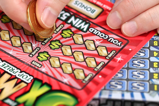 Hands holding lottery tickets